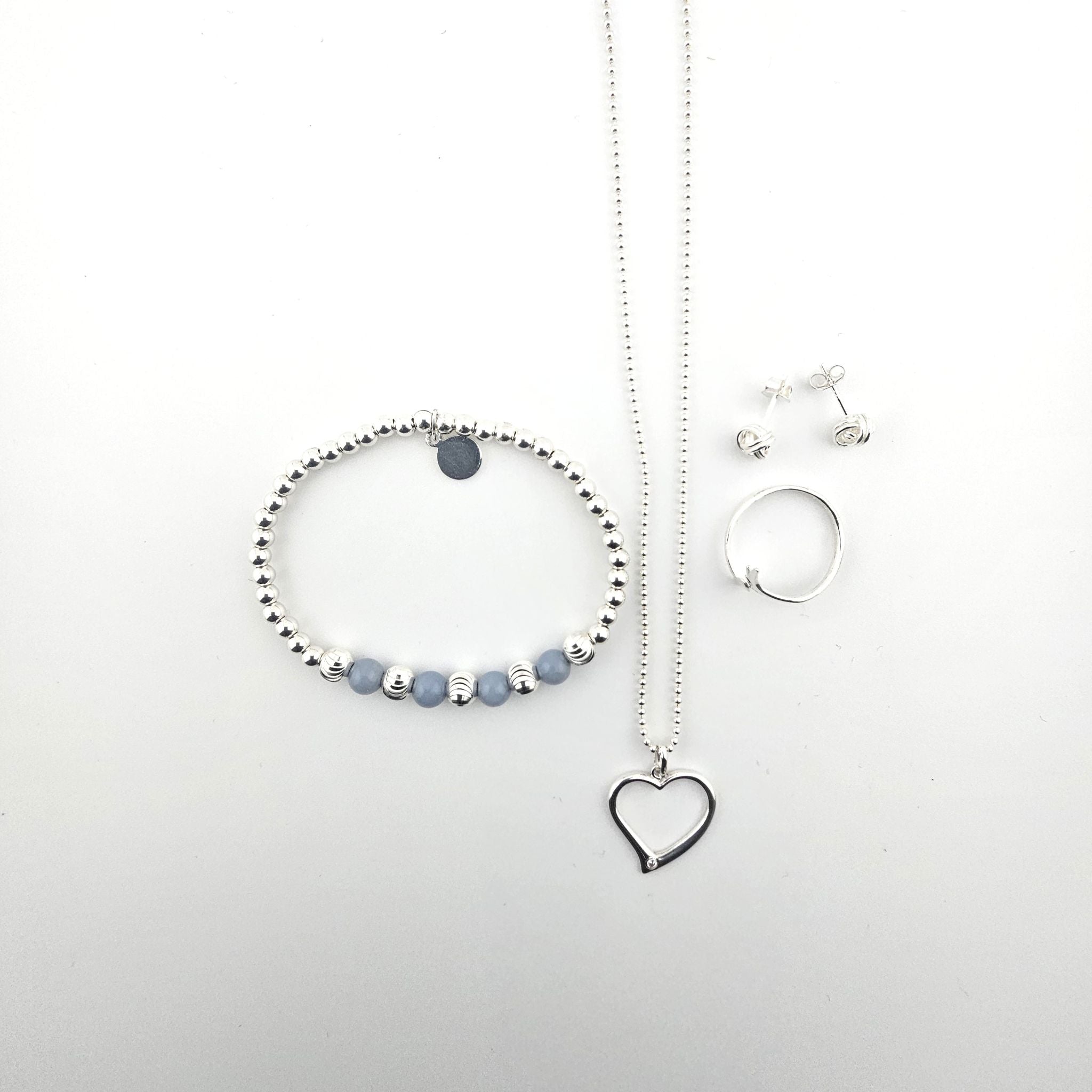 Bessie Bae sterling silver love and romance jewellery set with heart pendant necklace, beaded bracelet and silver ring.