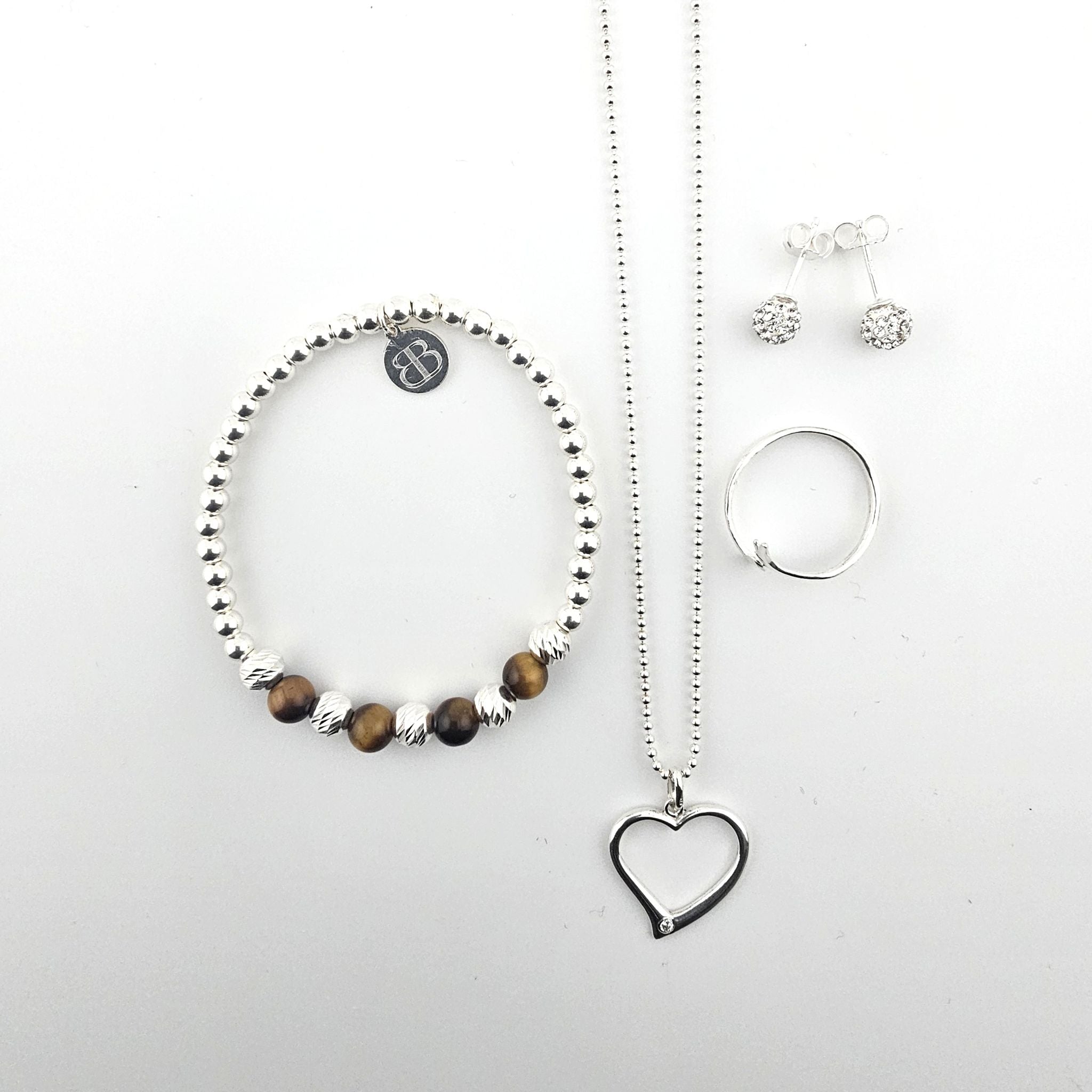 Bessie Bae sterling silver jewellery set with tiger’s eye beaded bracelet, heart pendant necklace, ring and stud earrings — new collection launch.