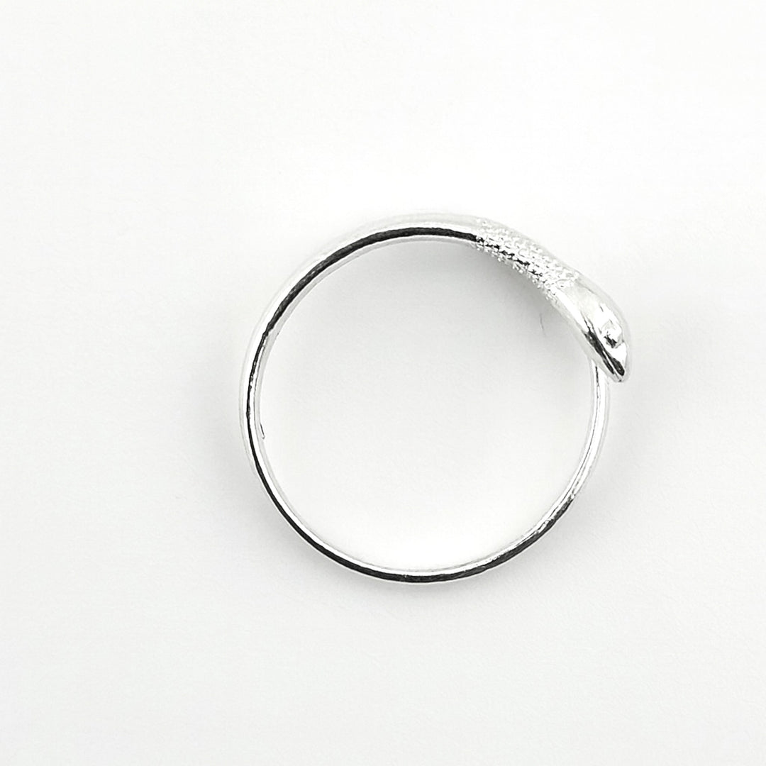 Adjustable sterling silver snake ring with detailed head design.