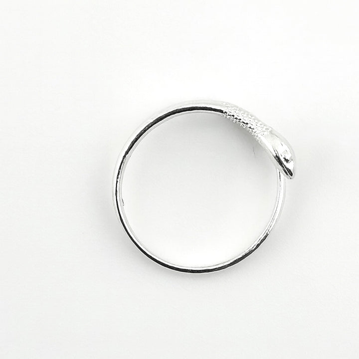 Adjustable sterling silver snake ring with detailed head design.