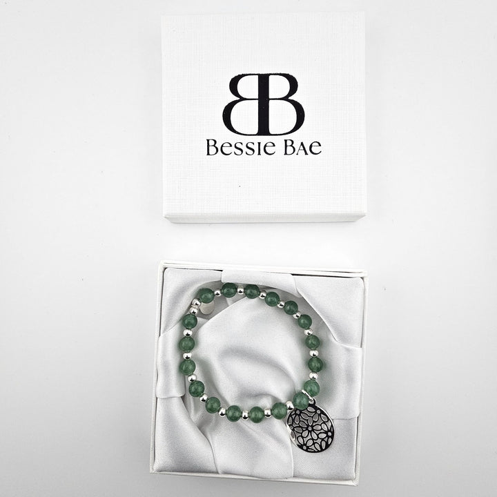 Green aventurine and silver charm bracelet in Bessie Bae gift box.