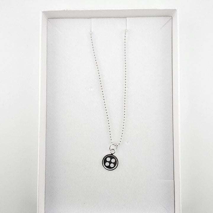 Sterling silver button charm necklace presented in Bessie Bae gift box.