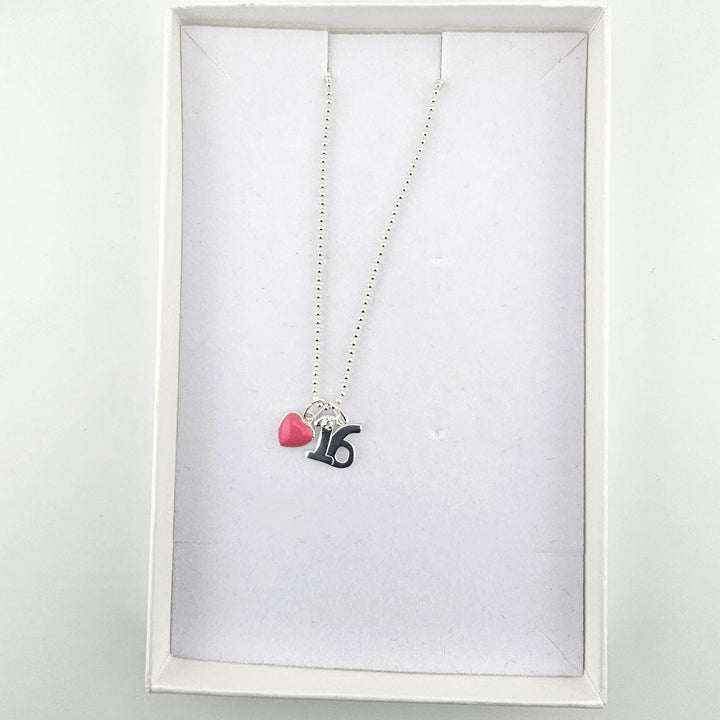 Sterling silver 16th birthday heart necklace displayed inside a white jewellery box.