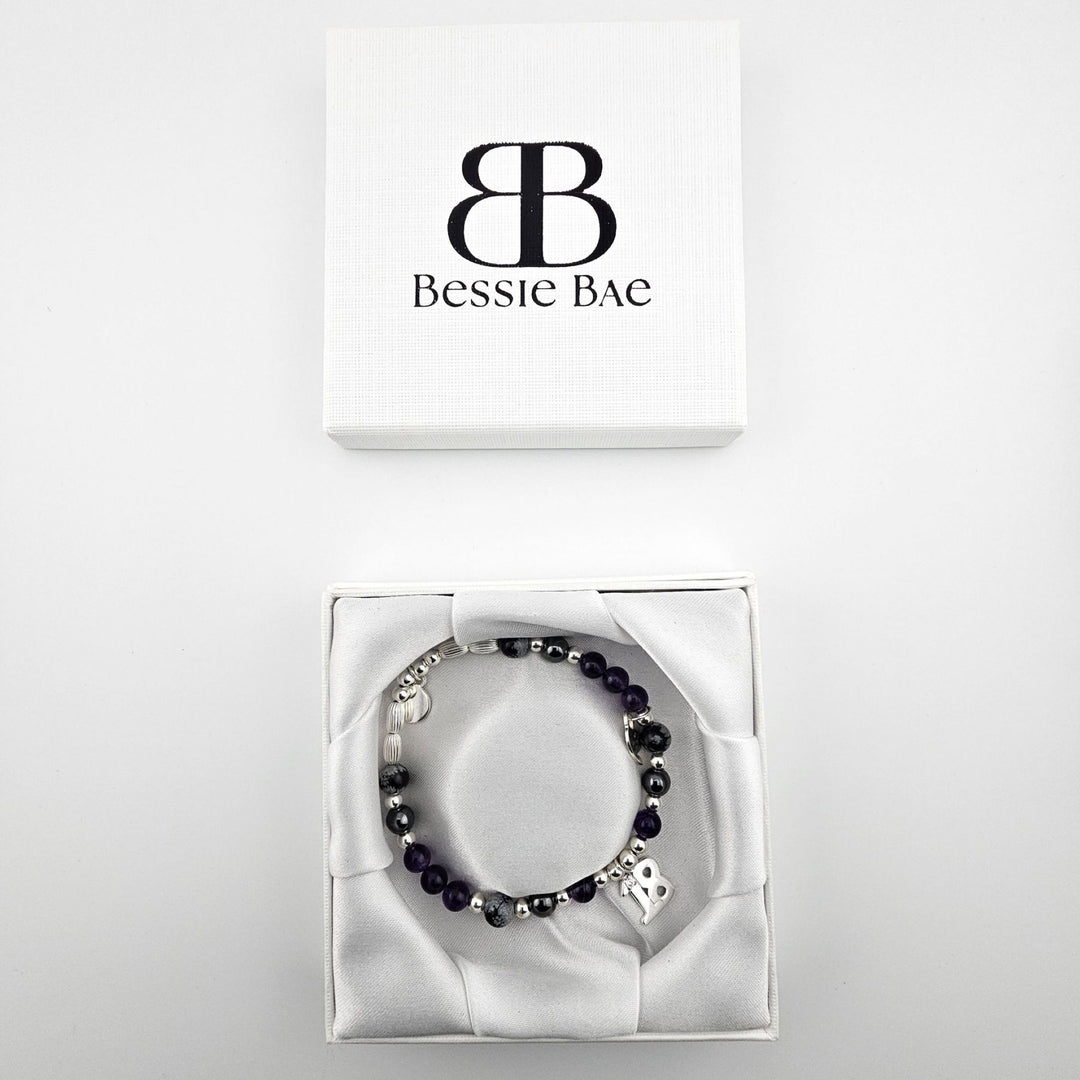 18th birthday Sterling Silver bracelet with Amethyst and Snowflake Obsidian gemstones in Bessie Bae gift box.