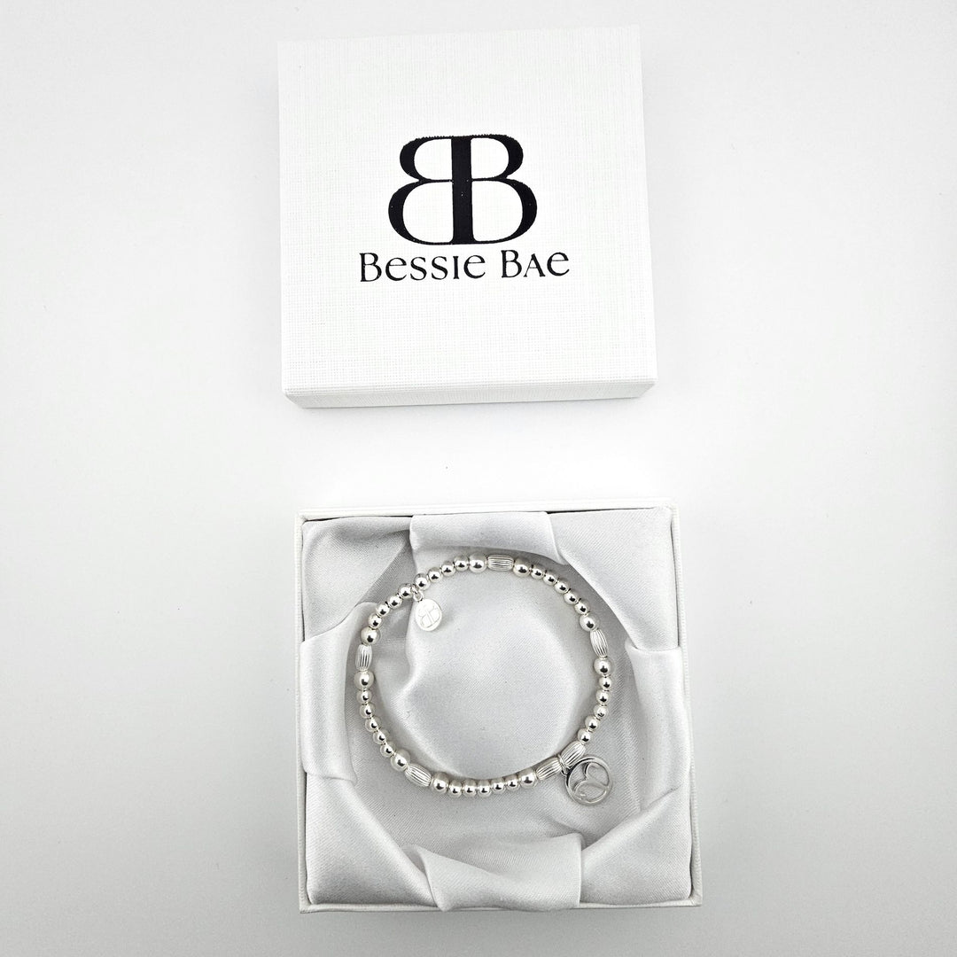 Aries charm sterling silver bracelet in white gift box.