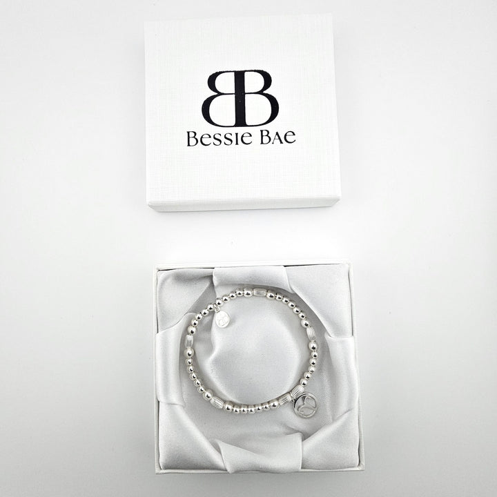 Aries charm sterling silver bracelet in white gift box.