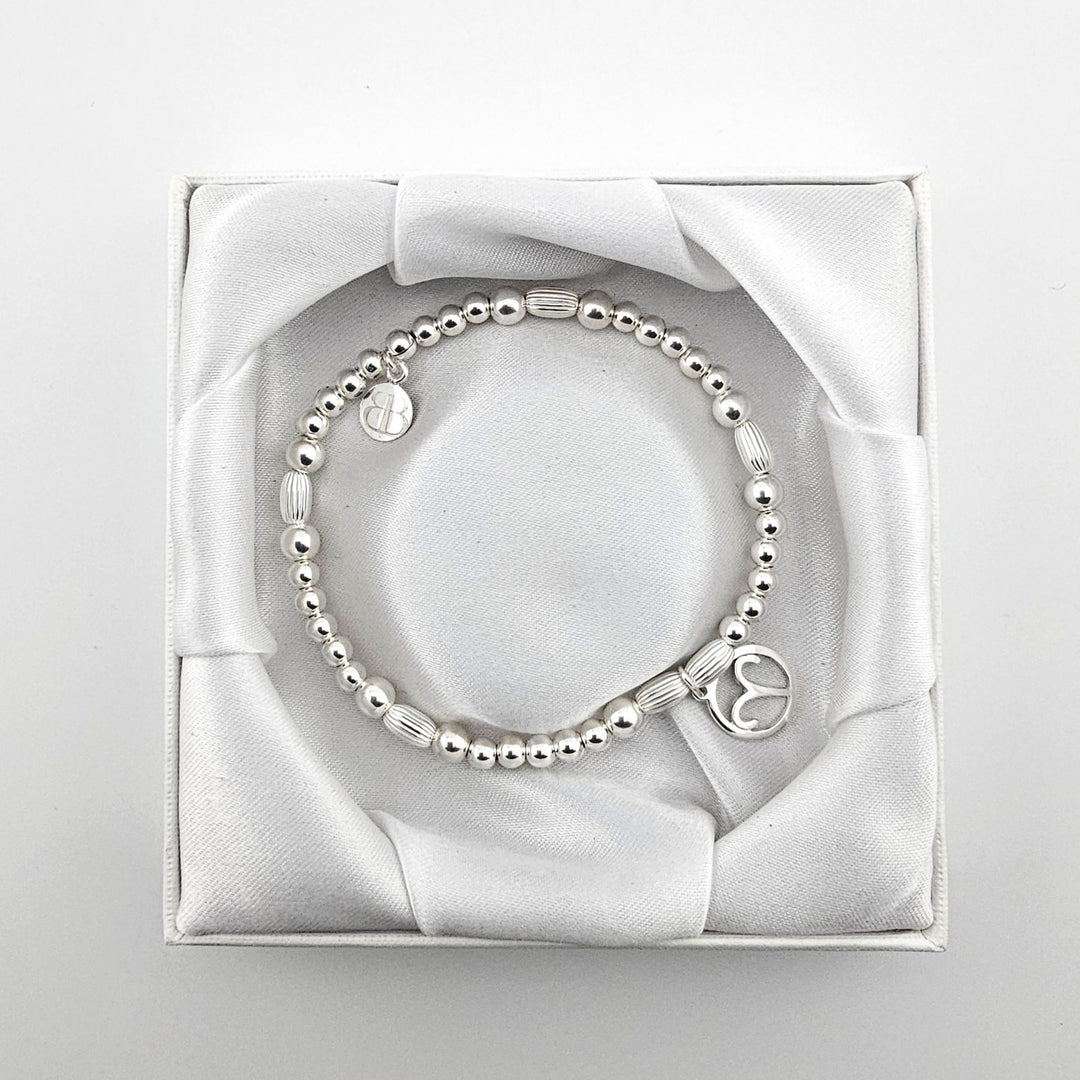 Bessie Bae Aries bracelet with packaging.