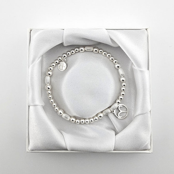 Bessie Bae Aries bracelet with packaging.