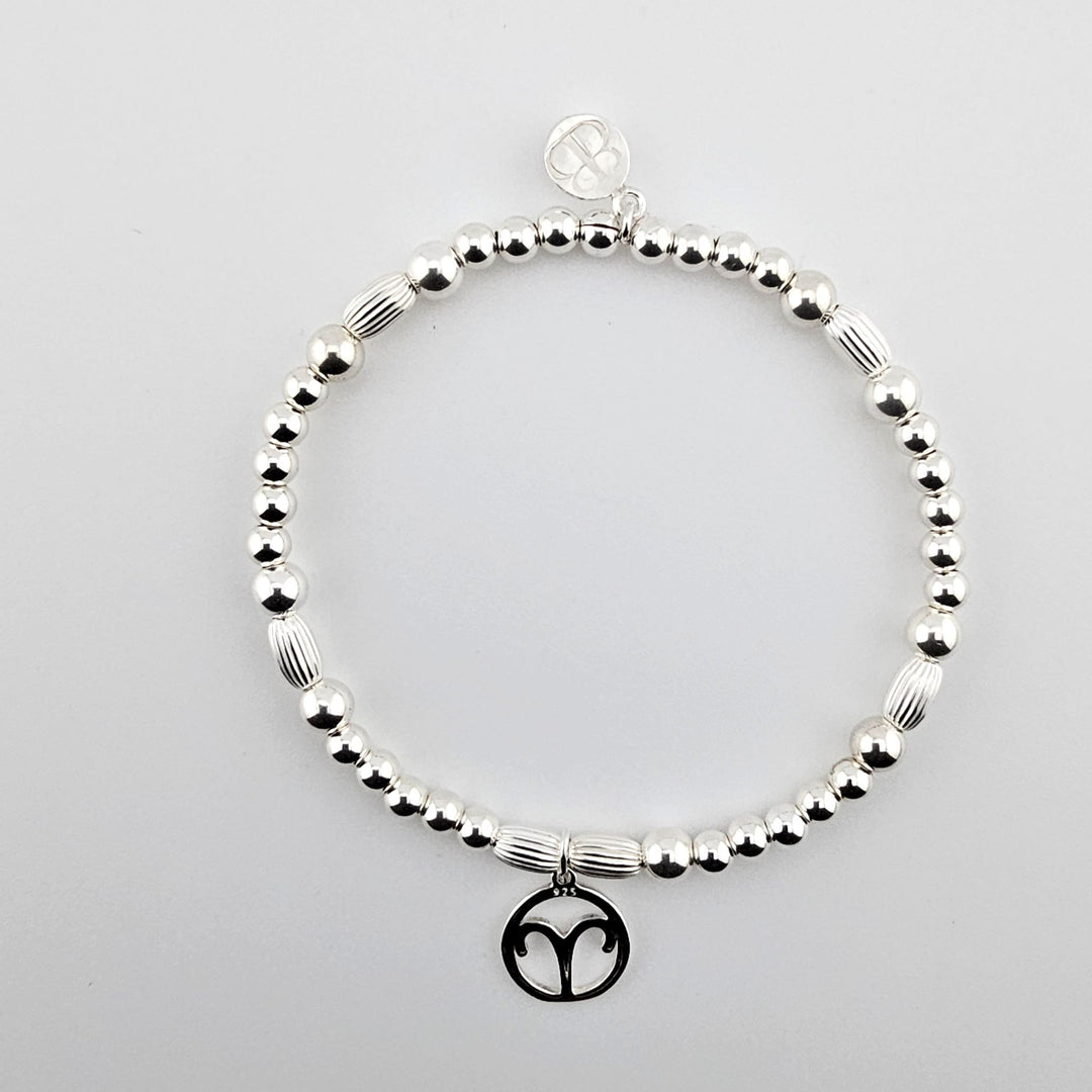 Sterling silver bracelet with Aries zodiac charm.