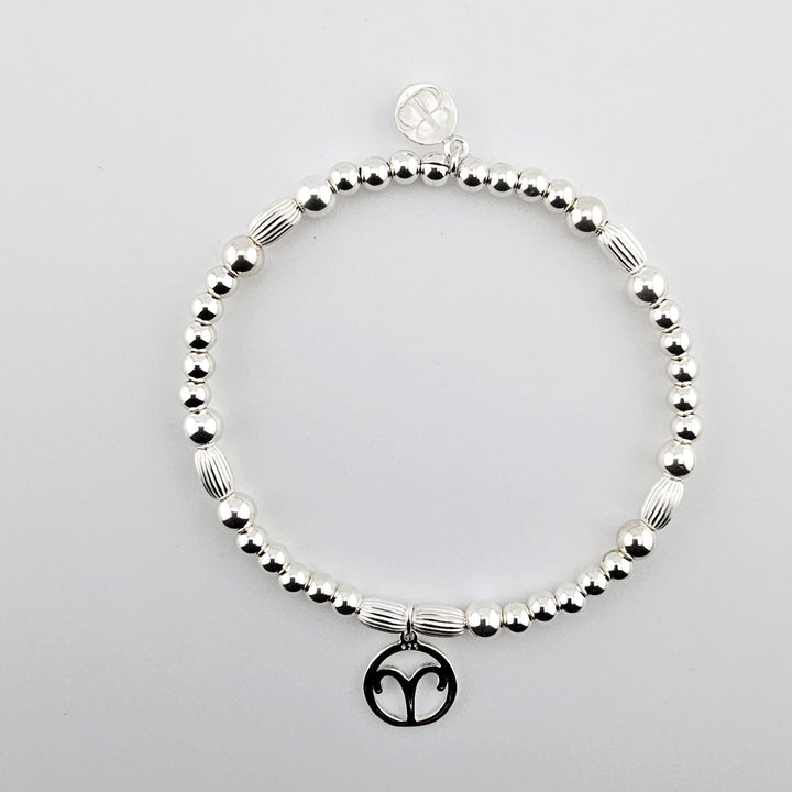 Sterling silver bracelet with Aries zodiac charm.