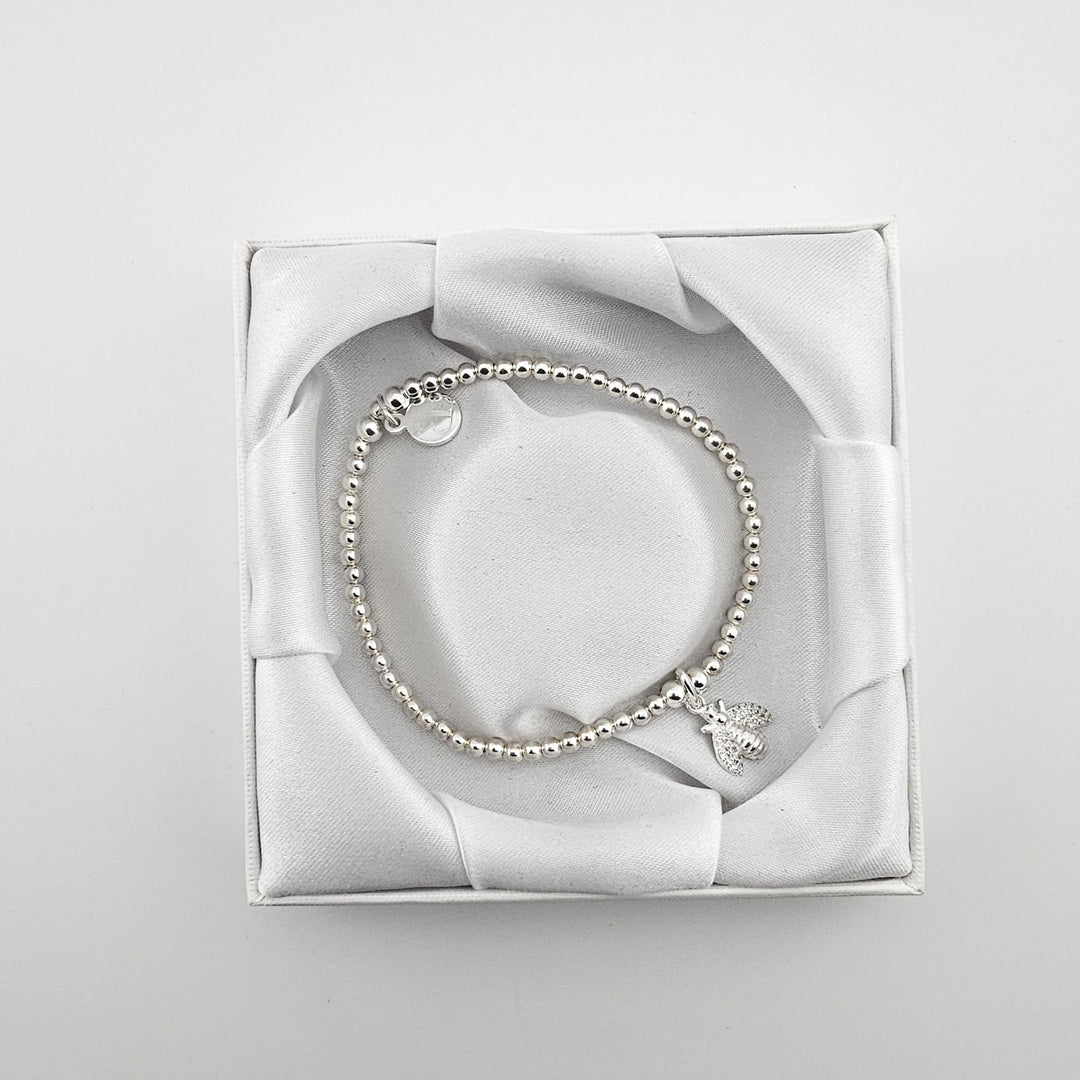 Bessie Bae bee bracelet with packaging.