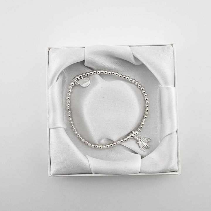 Bessie Bae bee bracelet with packaging.
