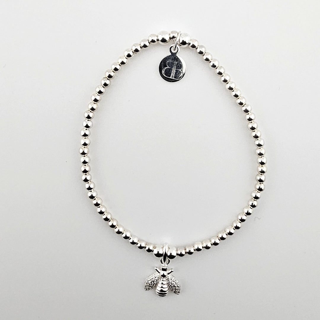 Sterling silver bracelet with sparkling bee charm.