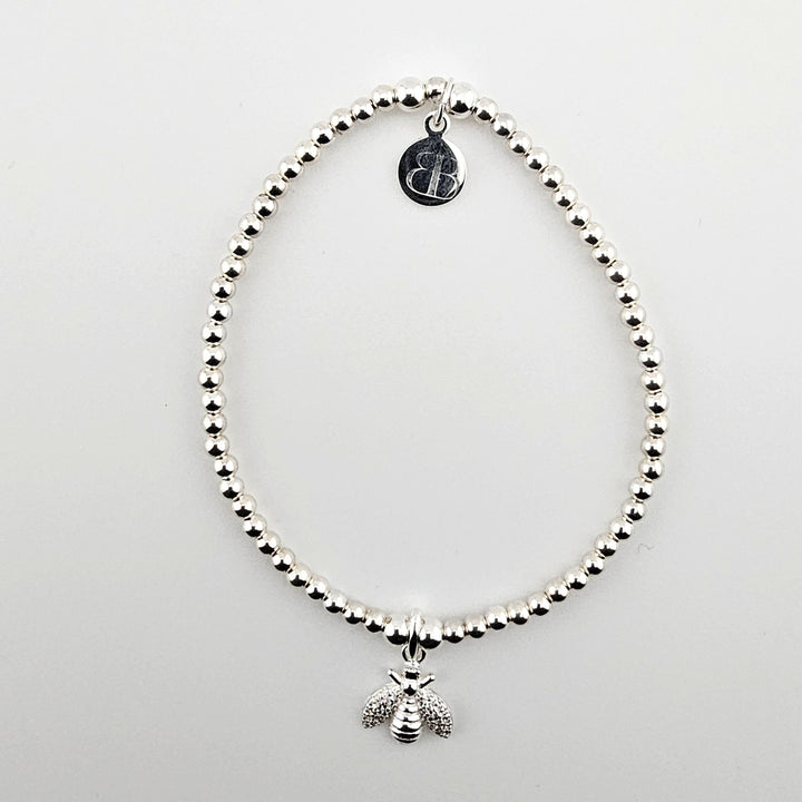 Sterling silver bracelet with sparkling bee charm.