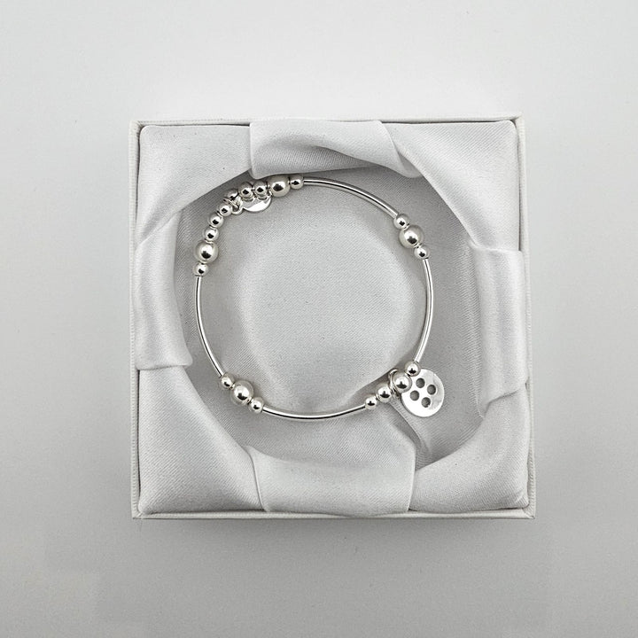 Bessie Bae packaging with Sterling Silver Button charm bracelet.