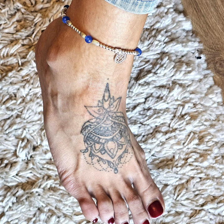 Cancer zodiac blue agate and sterling silver anklet worn on an ankle with a mandala tattoo.