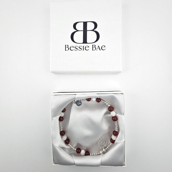 Garnet and Mother of Pearl anklet presented in open gift box.