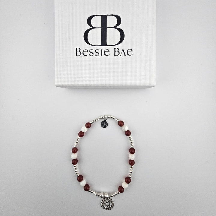 Flatlay of Garnet and Mother of Pearl sterling silver anklet.
