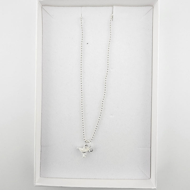 Bessie Bae London genie’s lamp necklace with branded packaging.