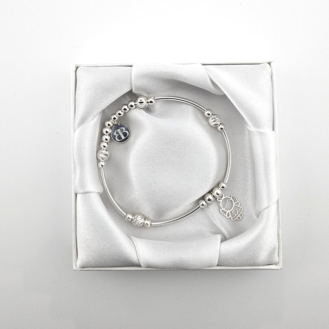 Bessie Bae angel bracelet with packaging.
