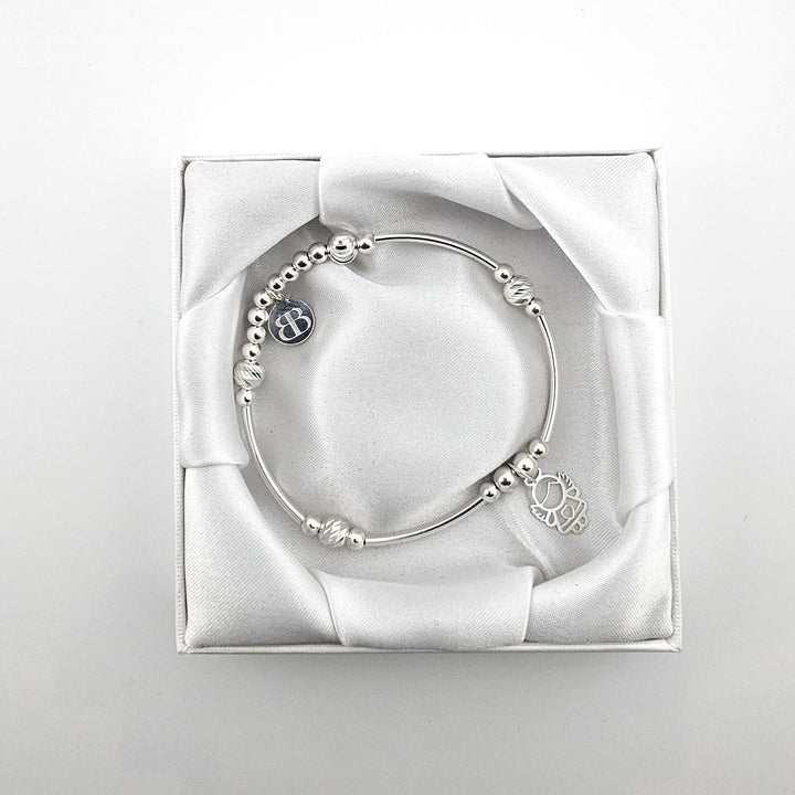 Bessie Bae angel bracelet with packaging.