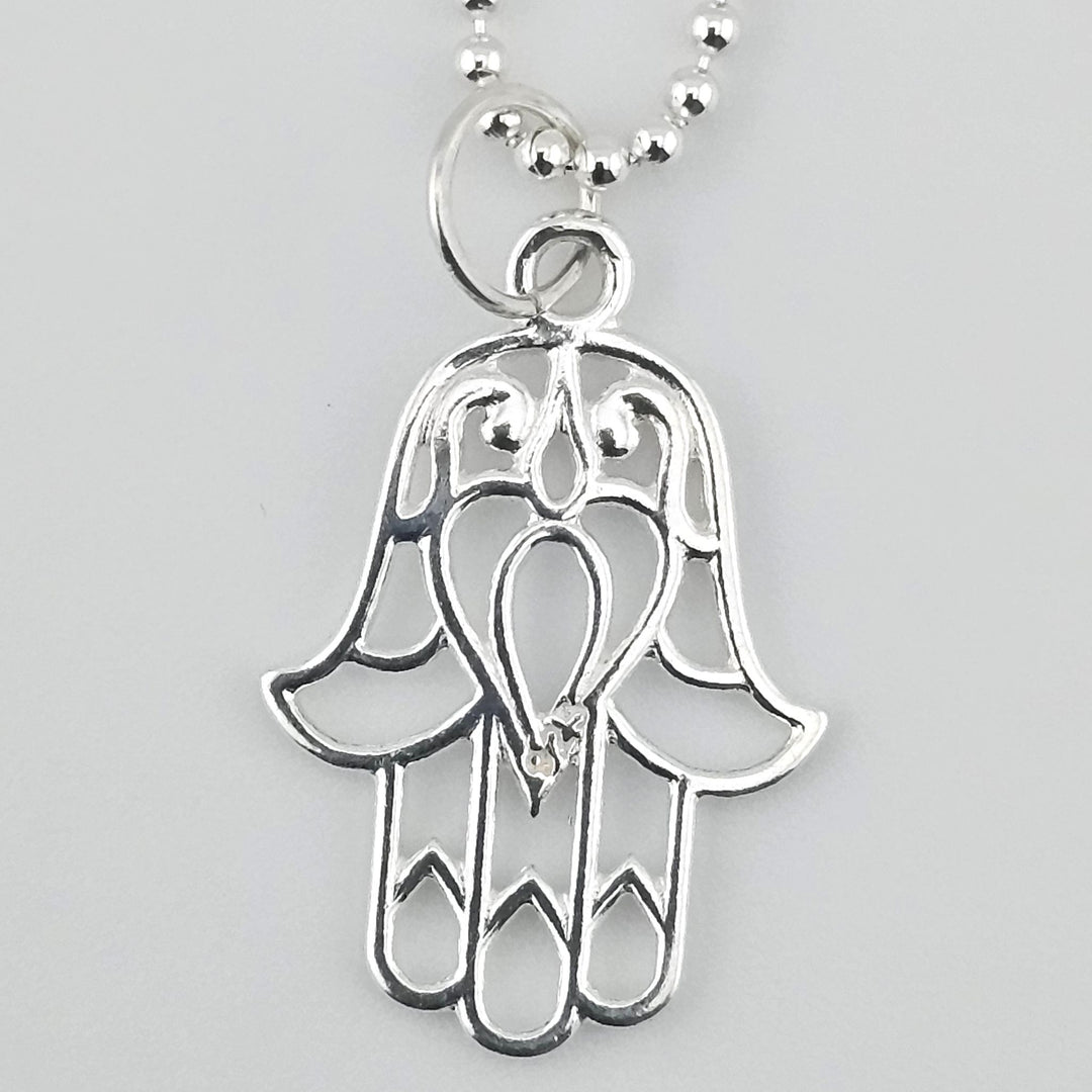 22mm open Hamsa charm in 925 sterling silver with detailed cut-out design.