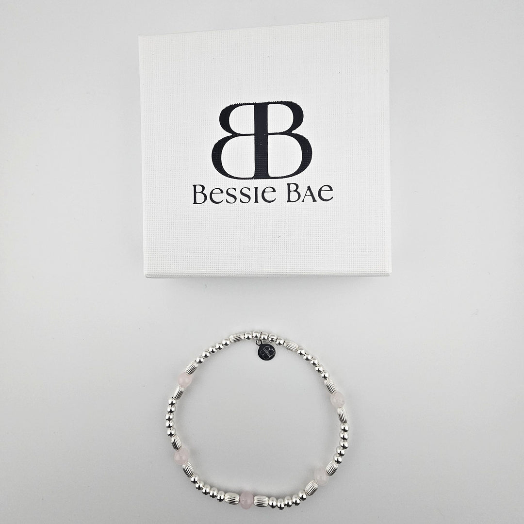 Bessie Bae sterling silver rose quartz anklet beside branded box.