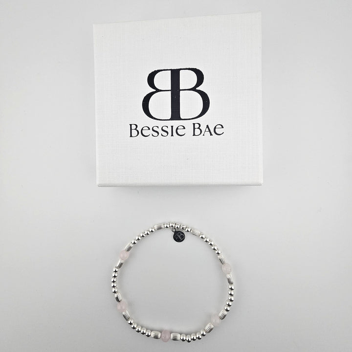 Bessie Bae sterling silver rose quartz anklet beside branded box.