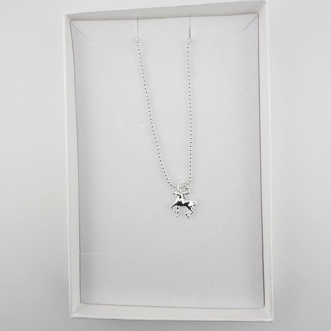 Sterling silver horse necklace presented in a Bessie Bae gift box.