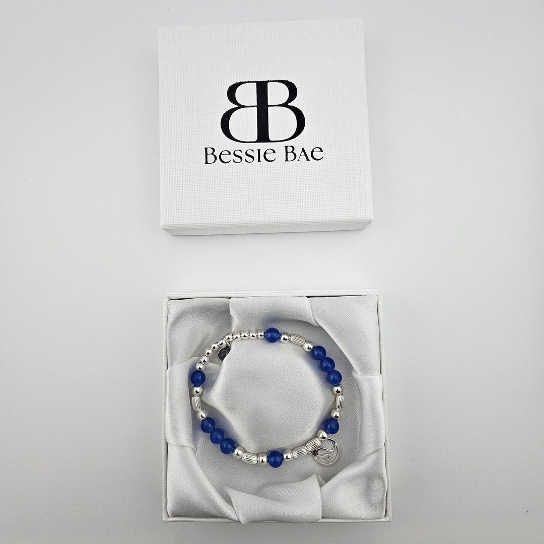 Leo zodiac bracelet in white Bessie Bae gift box.