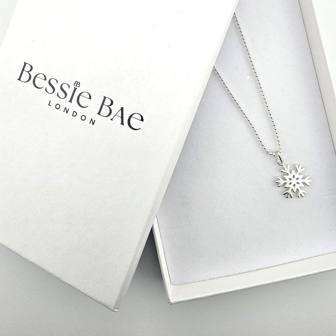 Bessie Bae London packaging with sterling silver snowflake necklace.