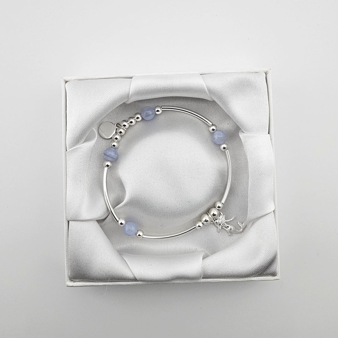 Mermaid charm sterling silver bracelet in white satin gift box.