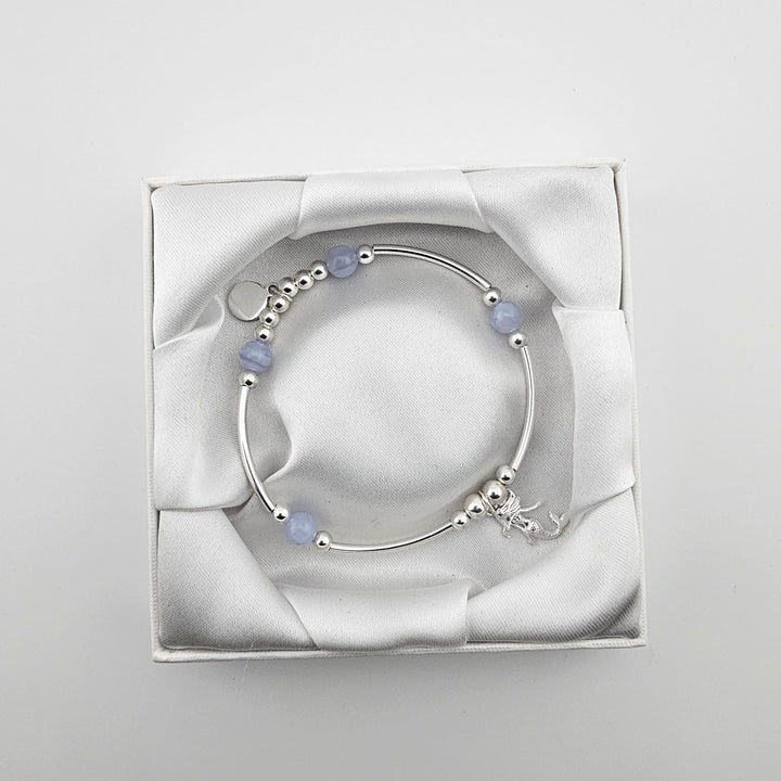 Mermaid charm sterling silver bracelet in white satin gift box.