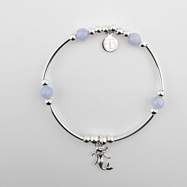 Sterling silver bracelet with mermaid charm and blue lace agate beads.