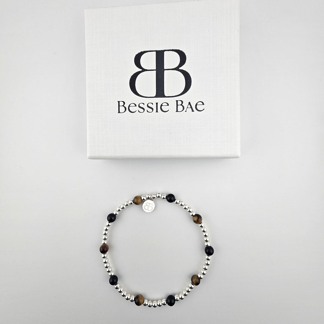 Bessie Bae Sterling Silver Onyx and Tiger’s Eye Anklet displayed with a white branded Bessie Bae gift box.