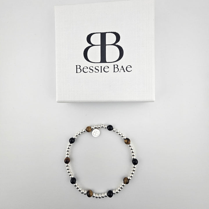 Bessie Bae Sterling Silver Onyx and Tiger’s Eye Anklet displayed with a white branded Bessie Bae gift box.