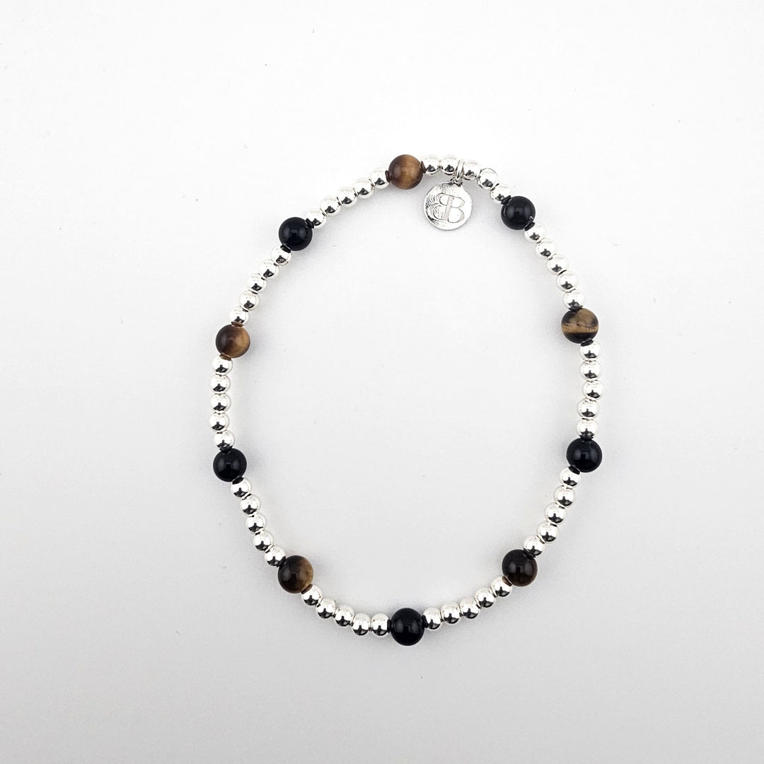 Sterling silver anklet with black onyx and tiger’s eye stones by Bessie Bae.