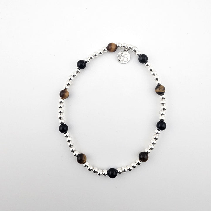 Sterling silver anklet with black onyx and tiger’s eye stones by Bessie Bae.
