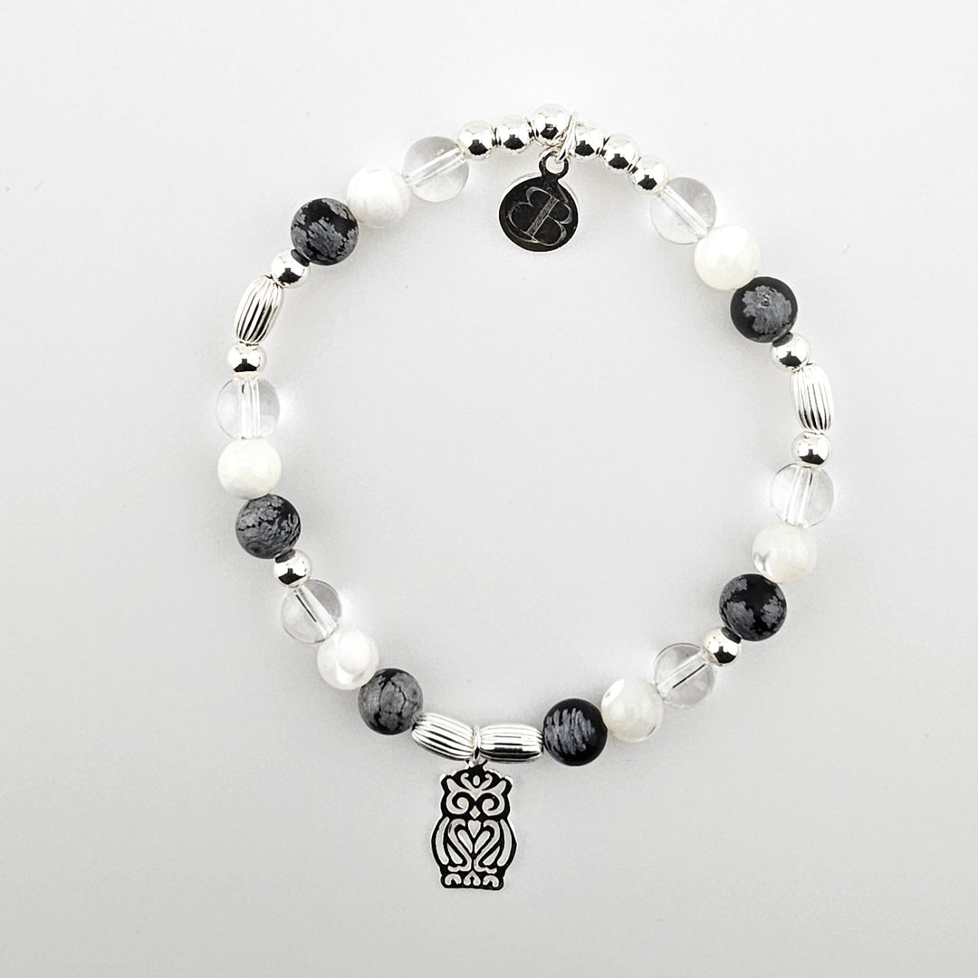 Sterling silver bracelet with owl charm and gemstone beads.