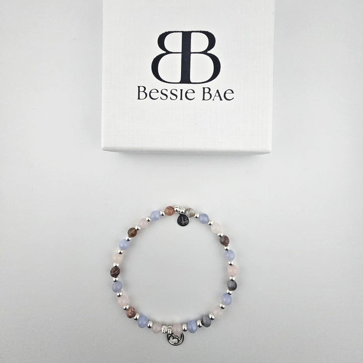 Multi-stone sterling silver anklet presented in white gift box.