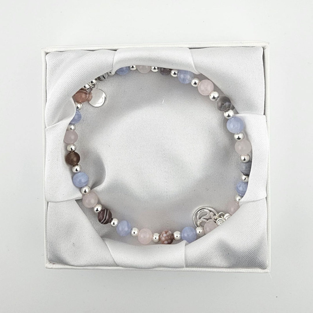Sterling silver pastel gemstone anklet displayed in luxury Bessie Bae gift box.