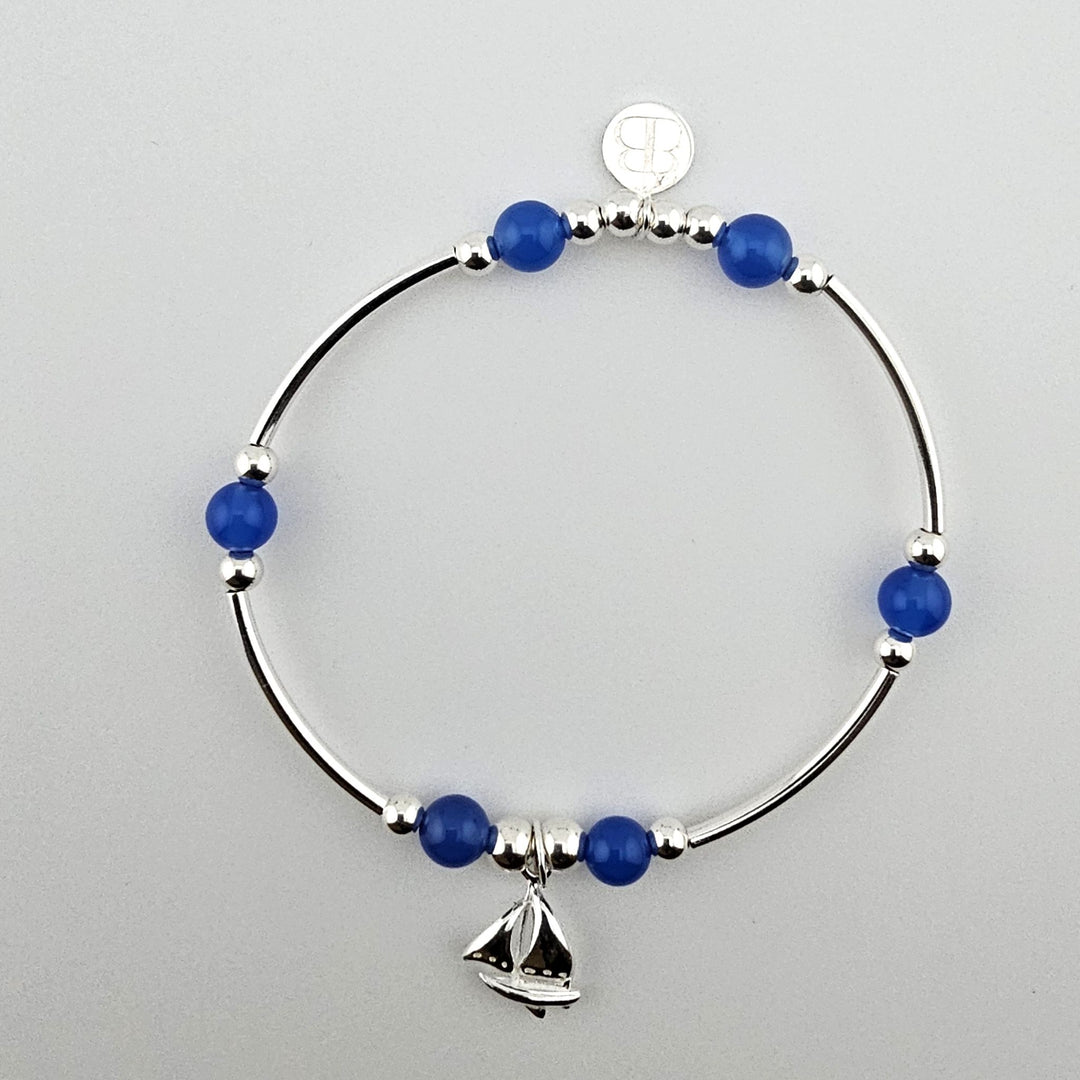 Sterling silver and blue agate bracelet with sailboat charm.