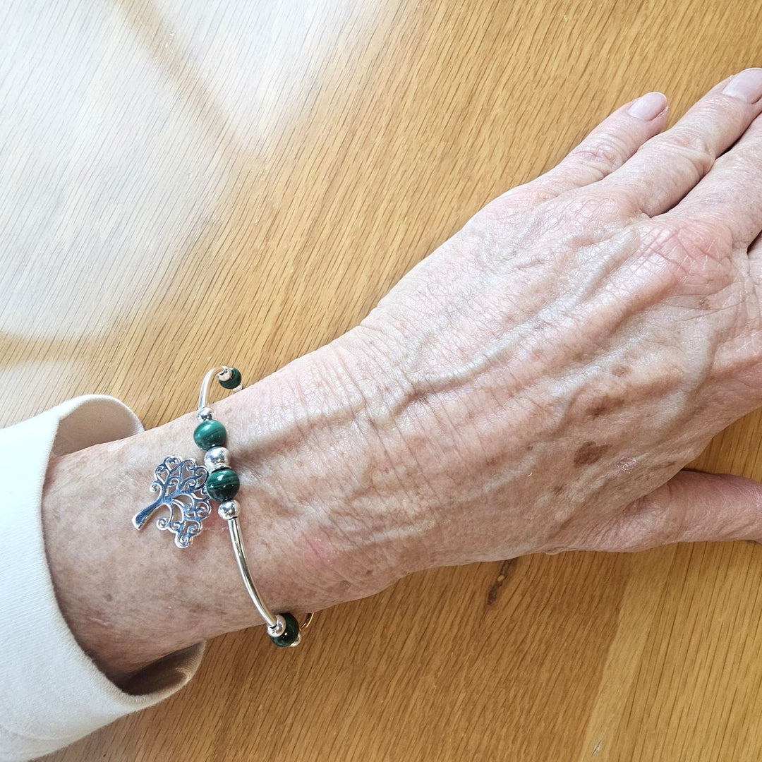 Sterling Silver and Malachite Tree of Life Bracelet by Bessie Bae on wrist.