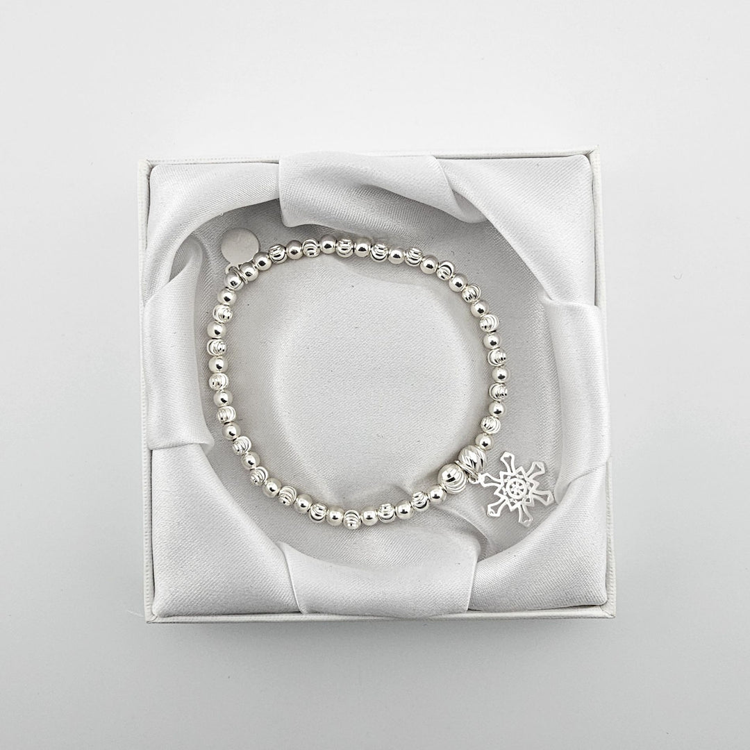 Bessie Bae snowflake bracelet with packaging.