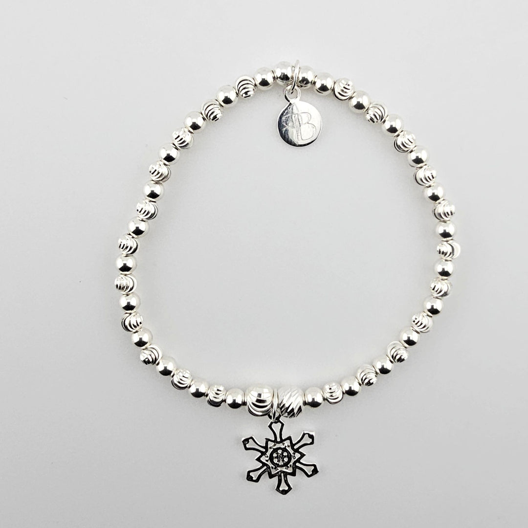 Sterling silver bracelet with snowflake charm.