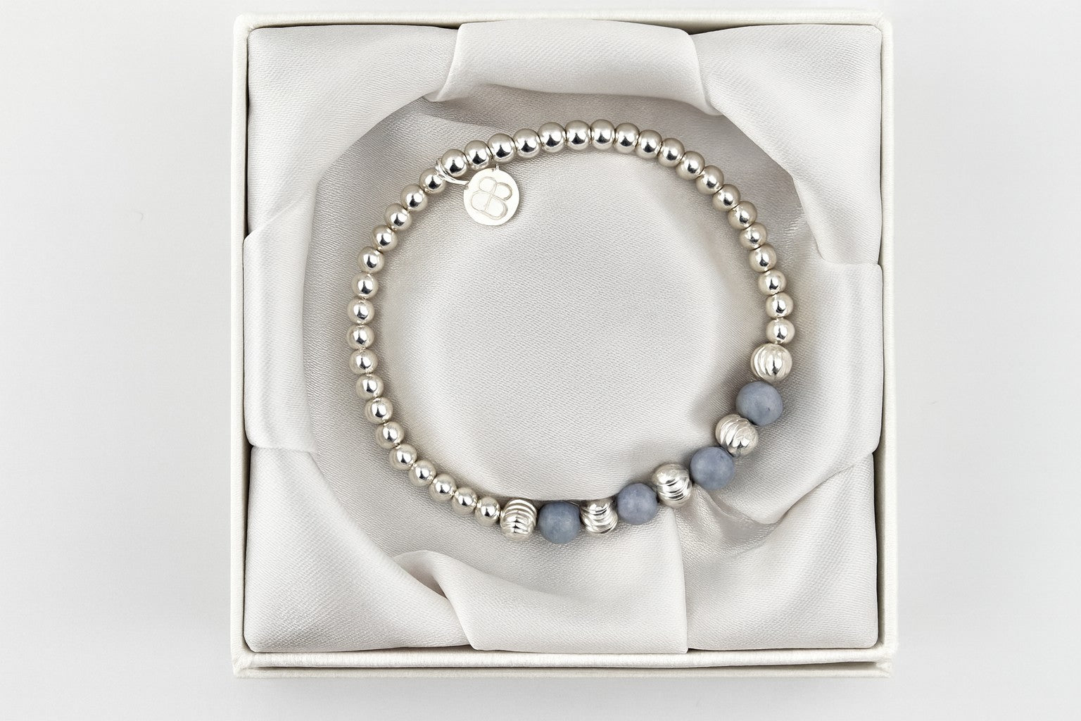 Luxury Bessie Bae gift box featuring a handcrafted silver beaded bracelet.