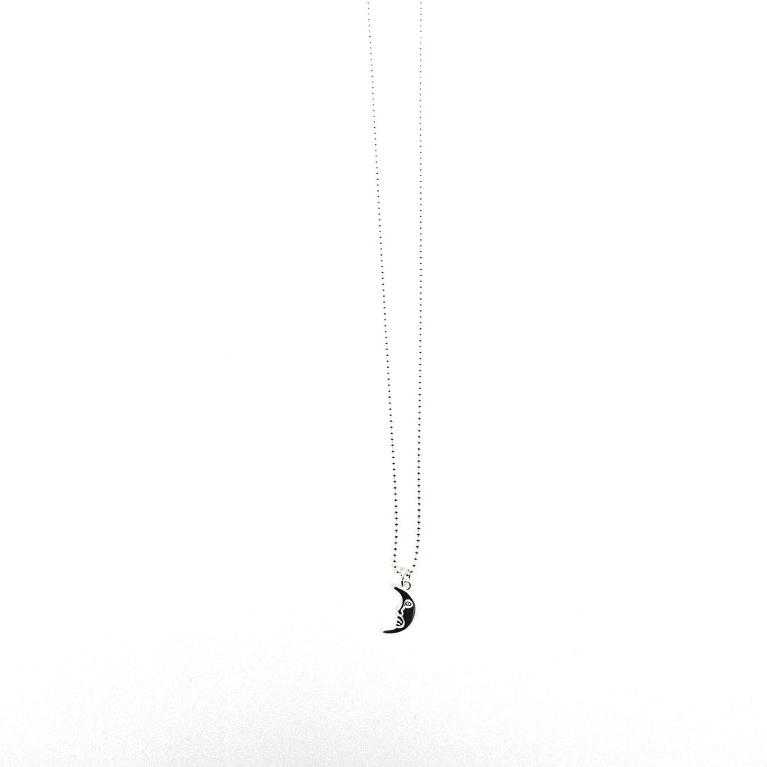 Sterling silver crescent moon necklace displayed on a light background.