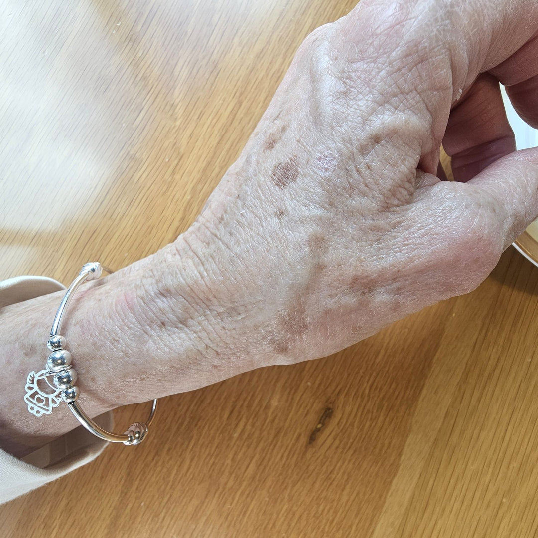 Sterling Silver Guardian Angel Bracelet by Bessie Bae worn on wrist.
