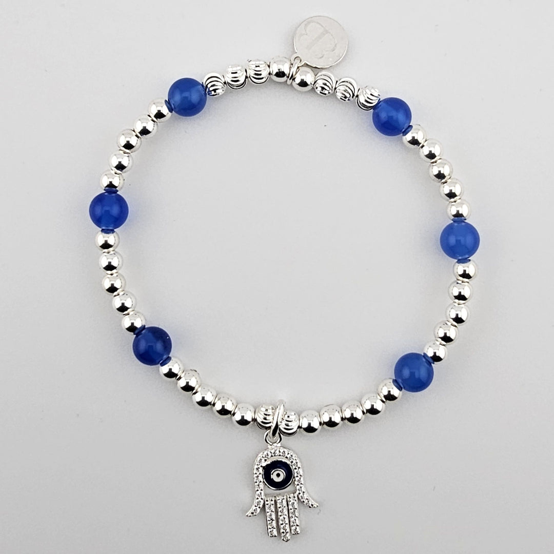 Sterling silver beaded bracelet with blue agate stones and Hamsa hand evil eye charm.