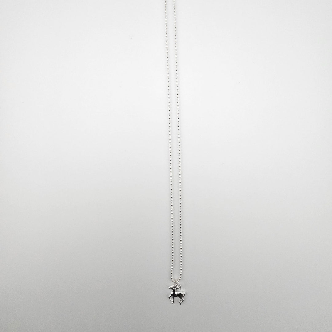Sterling silver horse necklace by Bessie Bae on a fine silver beaded chain.